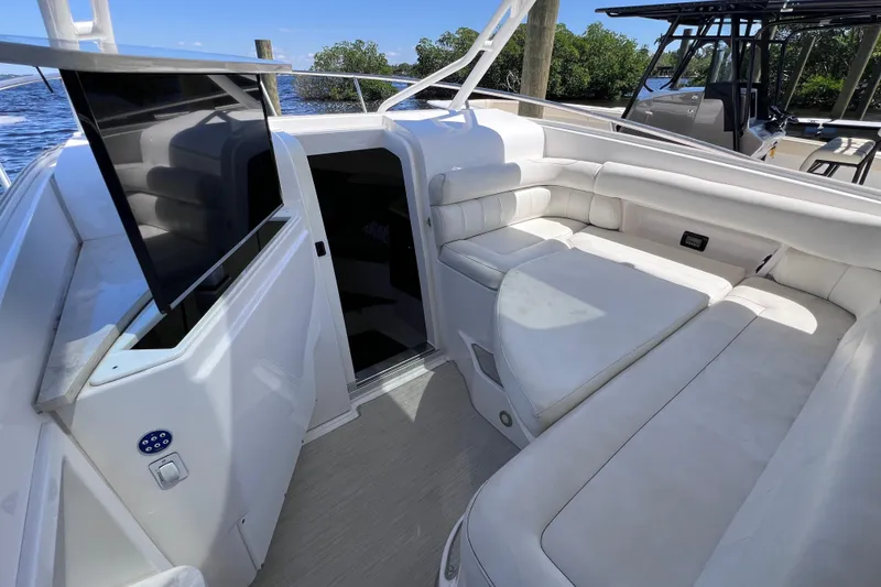 Slide: The Image of Luxurious 2017 Everglades 360LXC boat interior with plush white seating and modern amenities. - 74