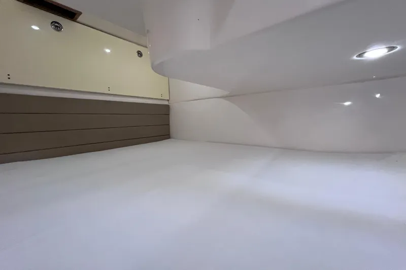 Slide: The Image of Interior cabin of 2017 Everglades 360LXC boat, featuring sleek design and ambient lighting. - 87