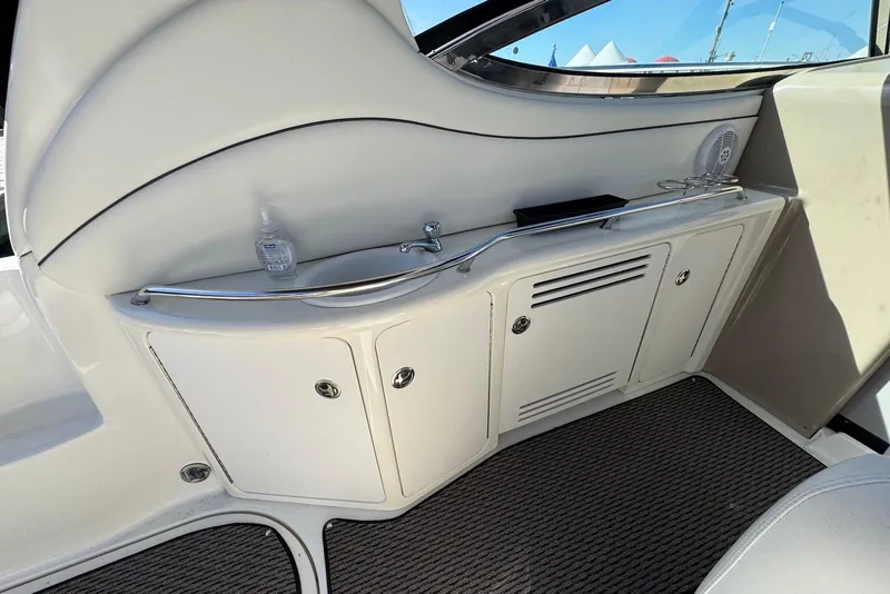 Slide: The Image of 2004 Sea Ray 360 Sundancer interior with sleek cabinetry and modern design. - 12