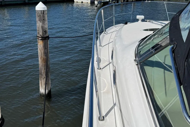 Slide: The Image of 2004 Sea Ray 360 Sundancer yacht docked at marina, side view. - 16
