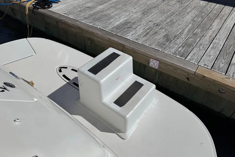 Slide: The Image of 2004 Sea Ray 360 Sundancer boat docked with step platform, slip number 50. - 19