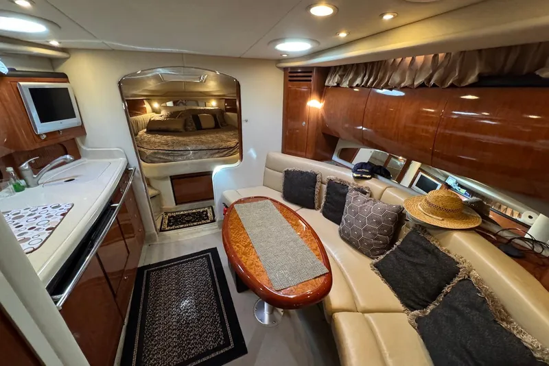 Slide: The Image of Luxurious interior of 2004 Sea Ray 360 Sundancer yacht with cozy seating and elegant decor. - 20