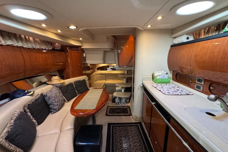 Slide: The Image of Luxurious interior of a 2004 Sea Ray 360 Sundancer yacht with elegant wood finishes. - 23