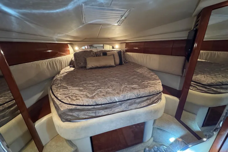 Slide: The Image of Luxurious cabin interior of 2004 Sea Ray 360 Sundancer yacht with plush bedding. - 24