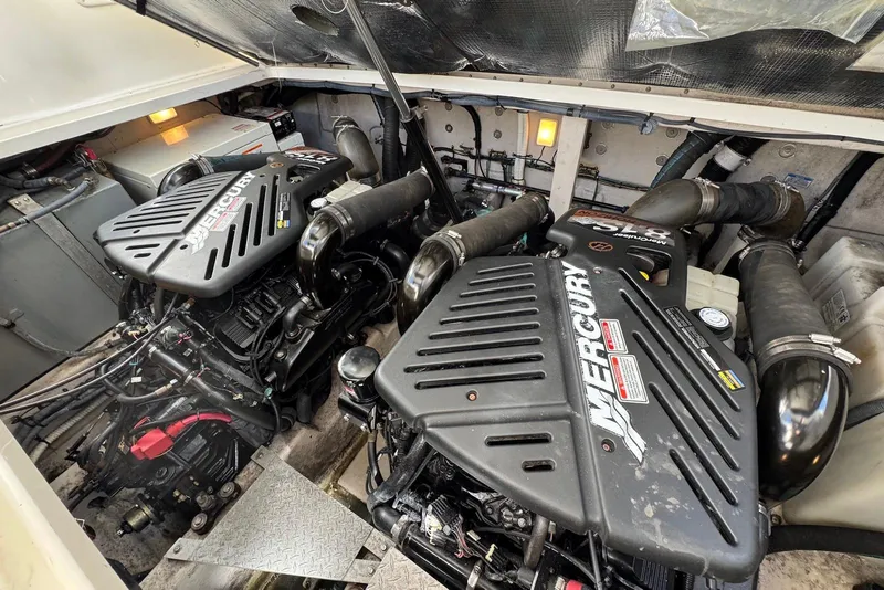 Slide: The Image of Engine room of a 2004 Sea Ray 360 Sundancer with twin Mercury engines. - 28