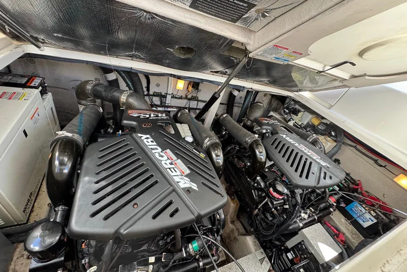 Slide: The Image of Engine compartment of a 2004 Sea Ray 360 Sundancer with twin Mercury engines. - 29