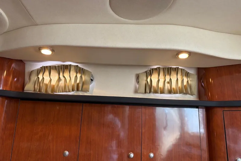 Slide: The Image of Interior of 2007 Sea Ray 340 Sundancer with wood cabinets and elegant lighting. - 14