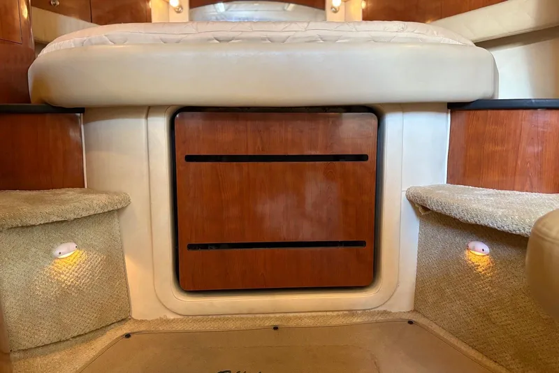 Slide: The Image of Interior cabin of 2007 Sea Ray 340 Sundancer with wood paneling and carpeted steps. - 16
