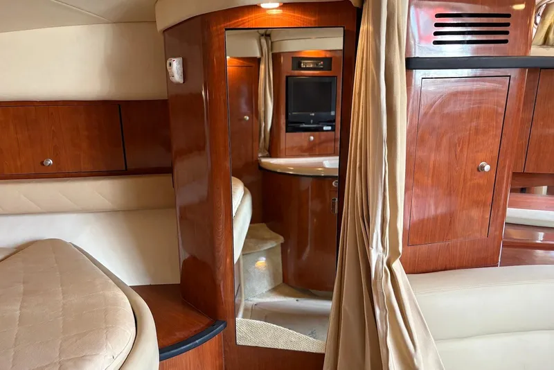 Slide: The Image of Luxurious interior of 2007 Sea Ray 340 Sundancer yacht with wood cabinetry and cozy seating. - 22
