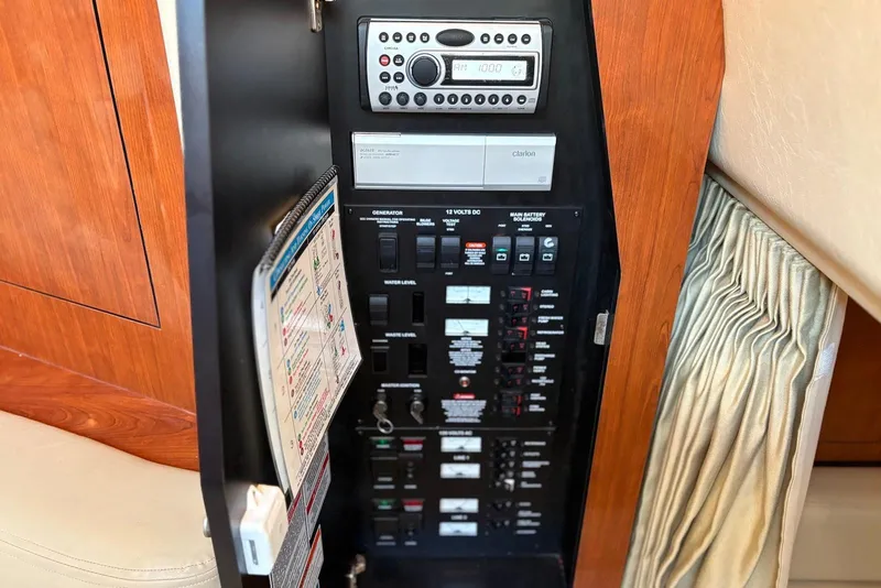 Slide: The Image of Electrical control panel on a 2007 Sea Ray 340 Sundancer boat interior. - 24