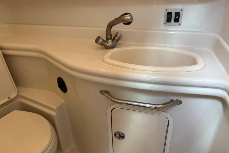 Slide: The Image of 2007 Sea Ray 340 Sundancer bathroom with sink, faucet, and toilet. - 33
