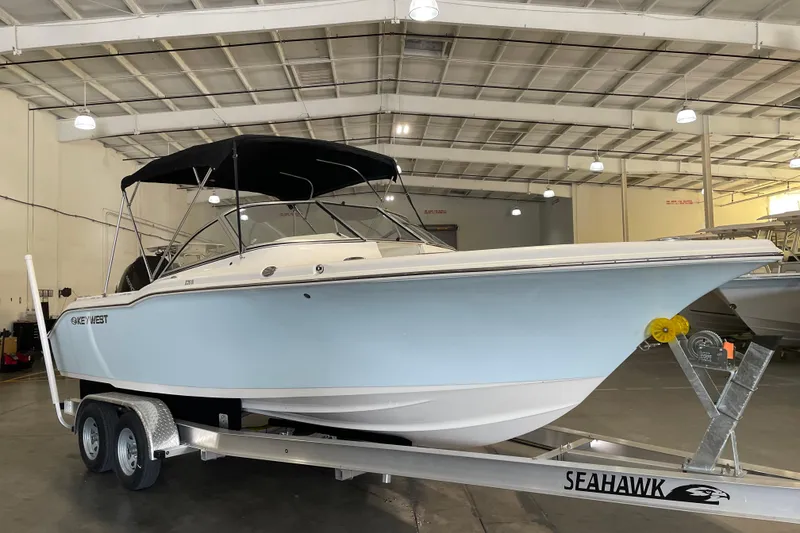 The Image of 2021 Key West 239 DFS boat on trailer in indoor storage facility. - 1