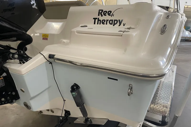 Slide: The Image of 2021 Key West 239 DFS boat with "Reef Therapy" text on the stern. - 10