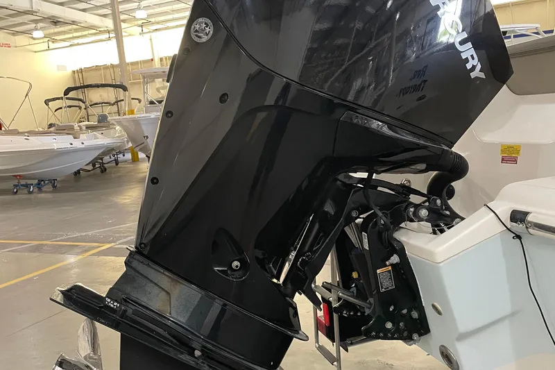 Slide: The Image of 2021 Key West 239 DFS boat with Mercury outboard motor in a showroom. - 11