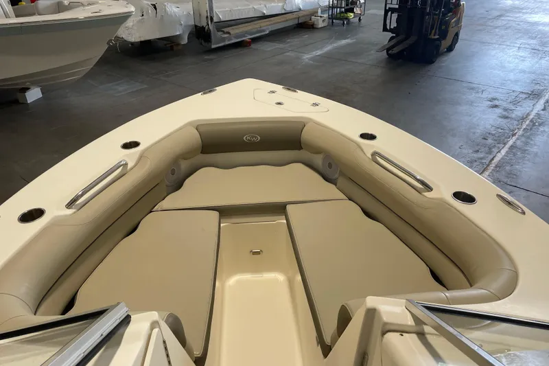 Slide: The Image of 2021 Key West 239 DFS boat interior with beige seating and cup holders. - 14