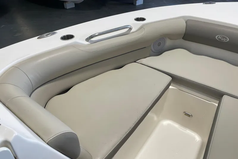 Slide: The Image of 2021 Key West 239 DFS boat interior with cushioned seating and storage compartment. - 15
