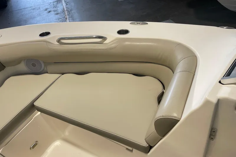 Slide: The Image of 2021 Key West 239 DFS boat interior with beige seating and cup holders. - 16