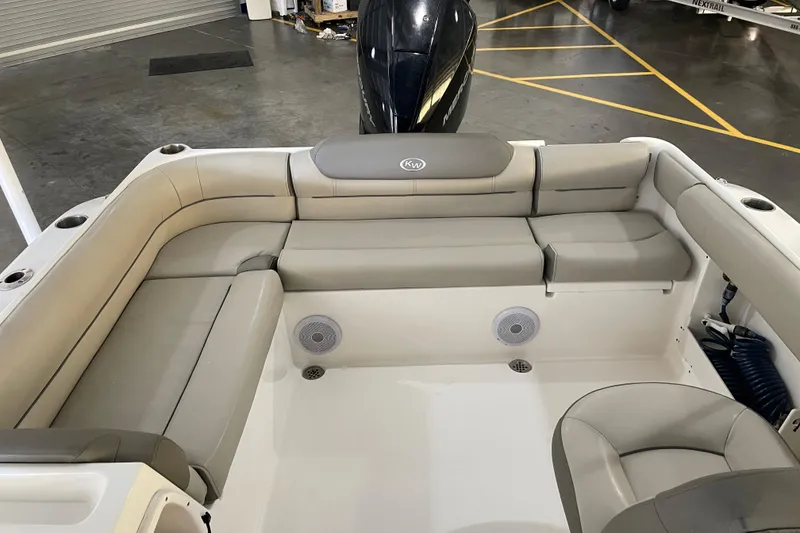 Slide: The Image of 2021 Key West 239 DFS boat interior with cushioned seating and speakers. - 29