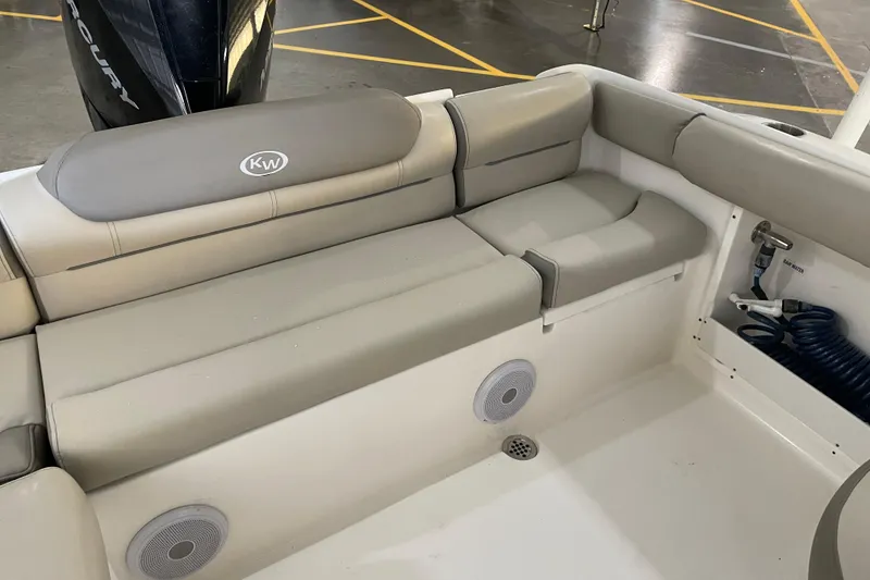 Slide: The Image of 2021 Key West 239 DFS boat interior with cushioned seating and speaker system. - 31