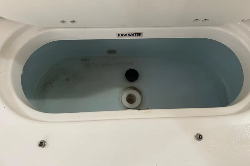 Slide: The Image of Livewell compartment in 2021 Key West 239 DFS boat, labeled "Raw Water." - 32