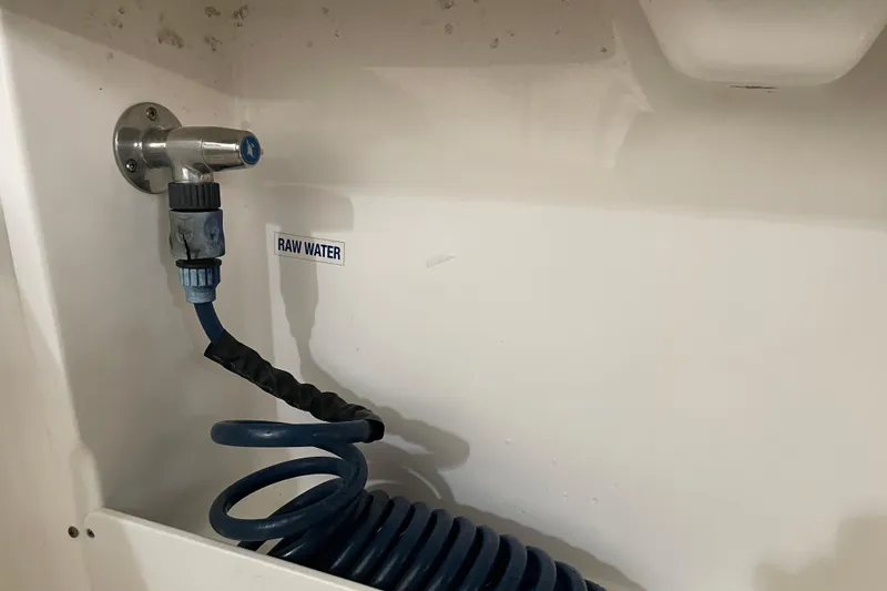 Slide: The Image of Raw water hose connection on 2021 Key West 239 DFS boat. - 33