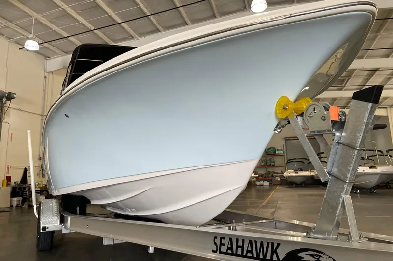 Slide: The Image of 2021 Key West 239 DFS boat on Seahawk trailer in indoor storage facility. - 6