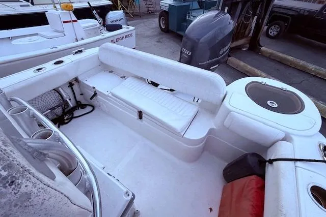 Slide: The Image of 2013 Sea Fox 226 Commander boat interior with seating and storage compartments. - 11