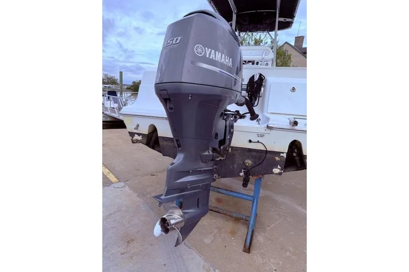 Slide: The Image of 2013 Sea Fox 226 Commander with Yamaha 150 outboard motor on display. - 13