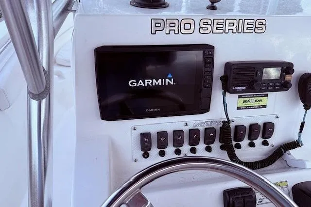 Slide: The Image of 2013 Sea Fox 226 Commander dashboard with Garmin GPS and marine radio. - 6