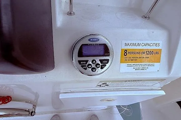 Slide: The Image of 2013 Sea Fox 226 Commander dashboard with capacity label and control panel. - 8