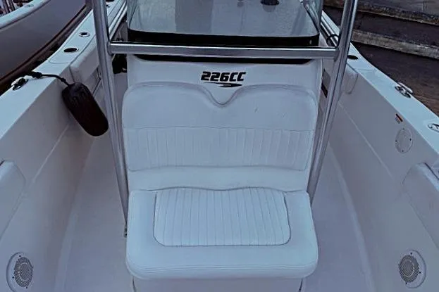 Slide: The Image of 2013 Sea Fox 226 Commander boat interior with white seating and console. - 9