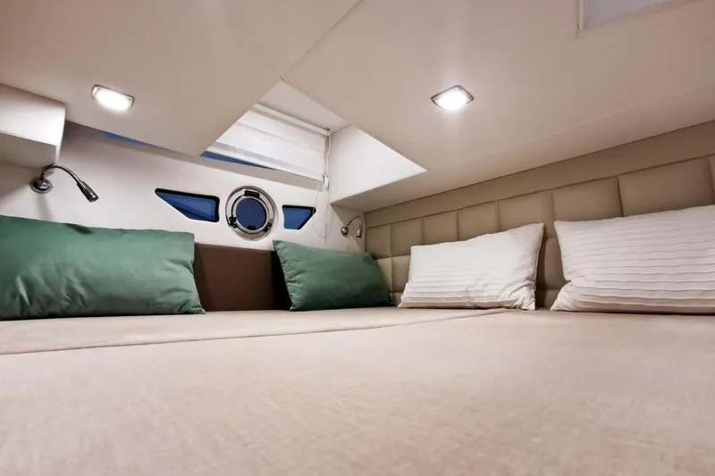 Slide: The Image of Luxurious cabin interior of 2026 Cobrey 28 SC yacht with cozy bedding. - 8