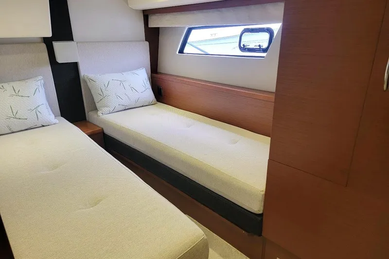 Slide: The Image of Interior cabin of 2013 Prestige 500 S yacht with twin beds and window view. - 10