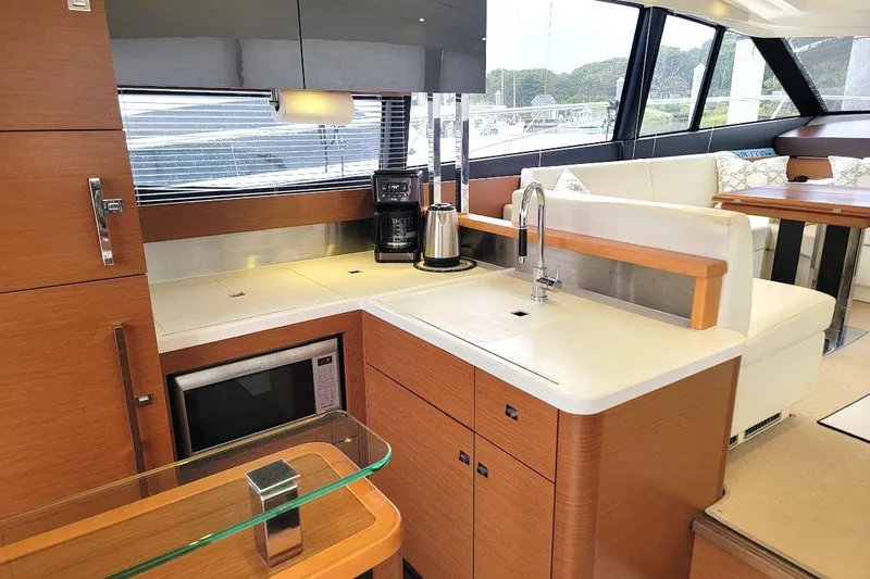 Slide: The Image of Luxurious 2013 Prestige 500 S yacht interior with modern kitchen and seating area. - 13