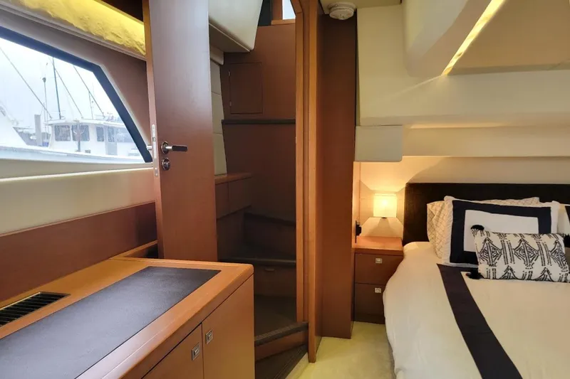 Slide: The Image of Luxurious interior of 2013 Prestige 500 S yacht with cozy bedroom and elegant wood finishes. - 17