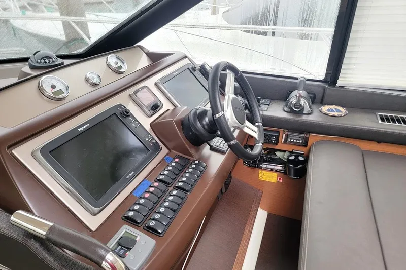 Slide: The Image of Interior helm of 2013 Prestige 500 S yacht with modern navigation controls. - 2