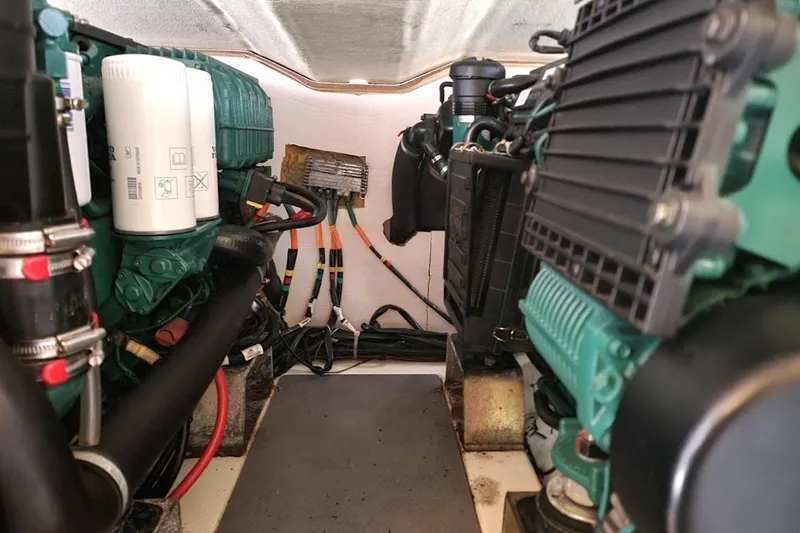 Slide: The Image of Engine room of a 2013 Prestige 500 S yacht, showcasing mechanical components. - 24