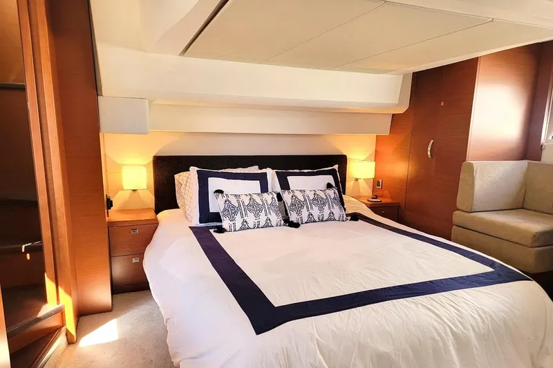 Slide: The Image of Luxurious bedroom interior of 2013 Prestige 500 S yacht with elegant bedding and warm lighting. - 3