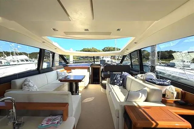 Slide: The Image of Luxurious interior of 2013 Prestige 500 S yacht with spacious seating and panoramic windows. - 35