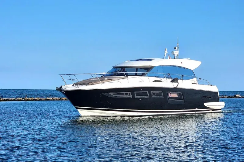 Slide: The Image of 2013 Prestige 500 S yacht cruising on calm blue waters. - 40