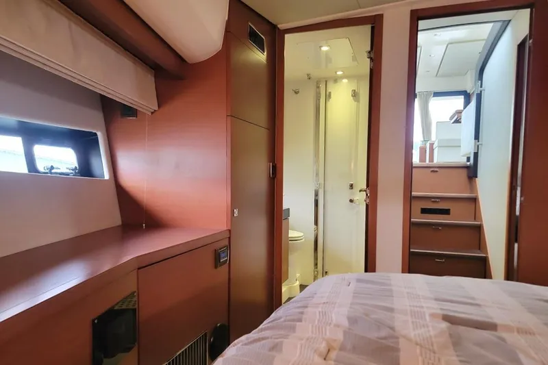Slide: The Image of Interior of 2013 Prestige 500 S yacht, featuring bedroom, bathroom, and stairs. - 7