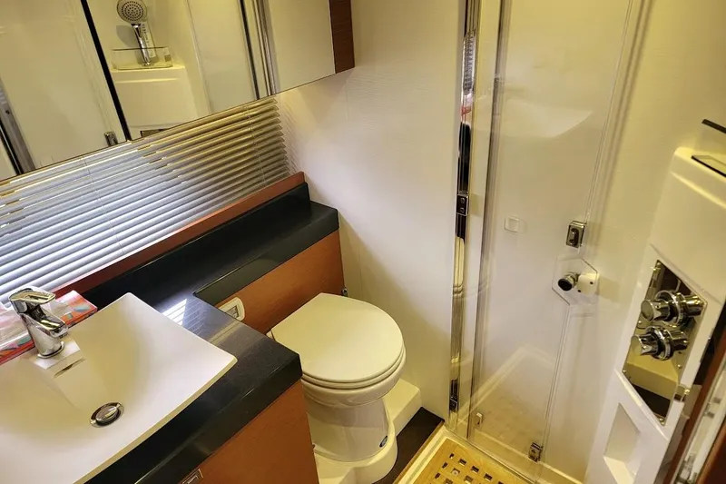 Slide: The Image of Luxurious bathroom in a 2013 Prestige 500 S yacht, featuring modern fixtures and a sleek design. - 8