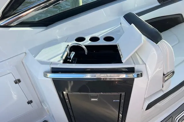 Slide: The Image of Dashboard of a 2017 Monterey 328SS Super Sport boat with gauges and navigation system. - 10