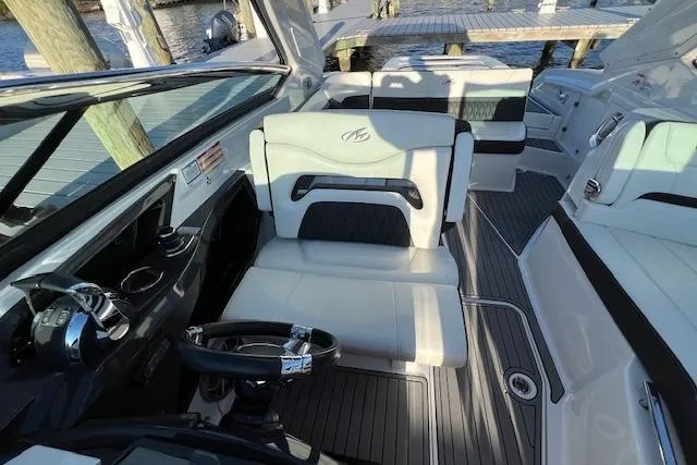 Slide: The Image of 2017 Monterey 328SS Super Sport boat with logo and nautical flags. - 4