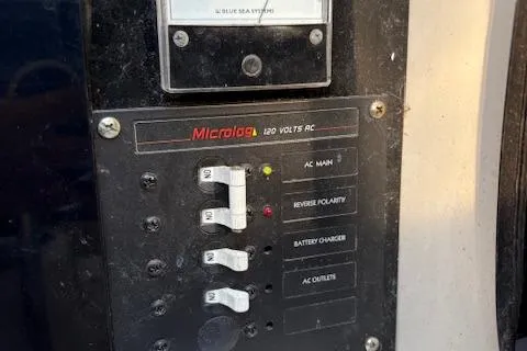 Slide: The Image of Control panel of a 1996 McGregor 26 boat with voltage indicators and switches. - 5