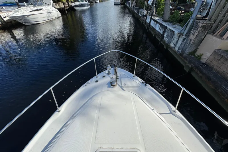 Slide: The Image of Bow view of 1999 Searay 340 Sundancer in a narrow canal. - 7