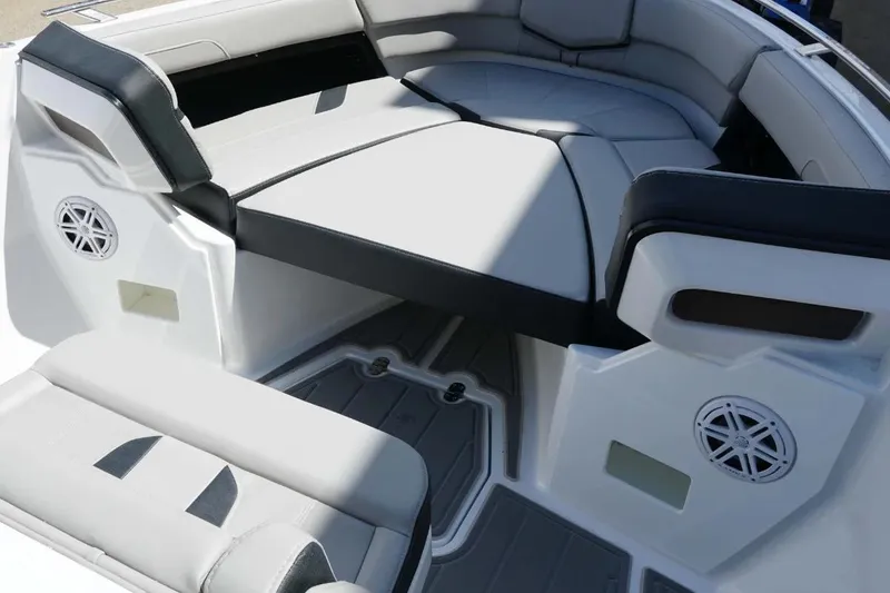 Slide: The Image of 2026 Monterey Elite 27 OB boat interior with cushioned seating and built-in speakers. - 8