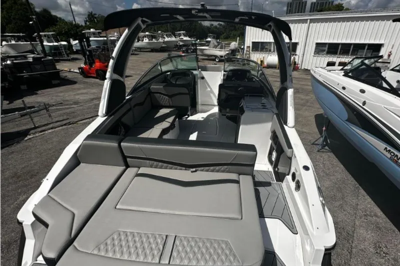 Slide: The Image of 2026 Monterey 275SS Super Sport boat with sleek interior design and spacious seating. - 2