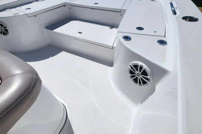 Slide: The Image of 2018 Sportsman Masters 247 Bay Boat interior with seating and storage compartments. - 10