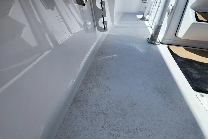 Slide: The Image of 2018 Sportsman Masters 247 Bay Boat deck, showcasing clean, spacious design and durable materials. - 14